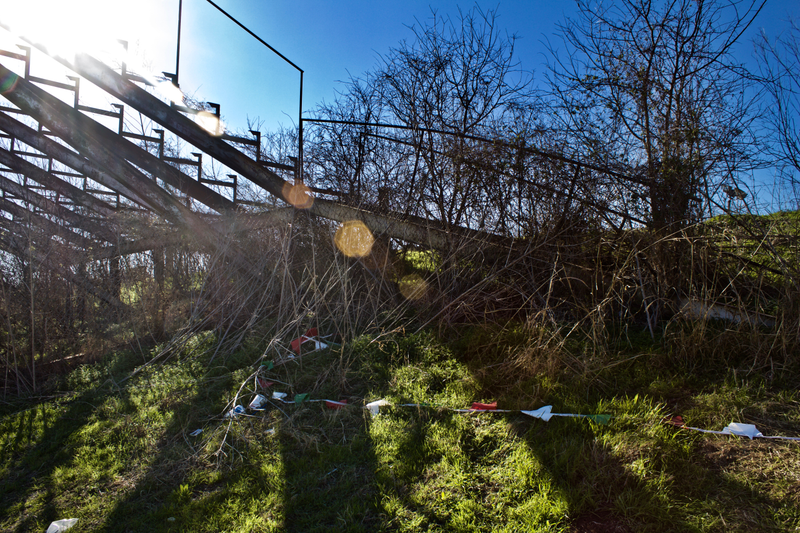 These days, only occupants of the Longhorn grandstands are weeds and items littered by the local weekend flea market.
